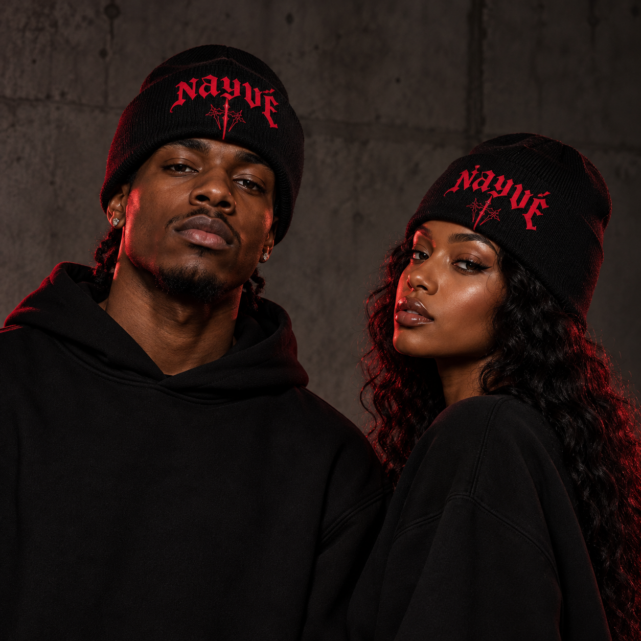 AI styling mockup of two adult models wearing the black and red NAYVÉ beanie